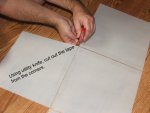 Trimming off the tape from the corners of the acrylic panels